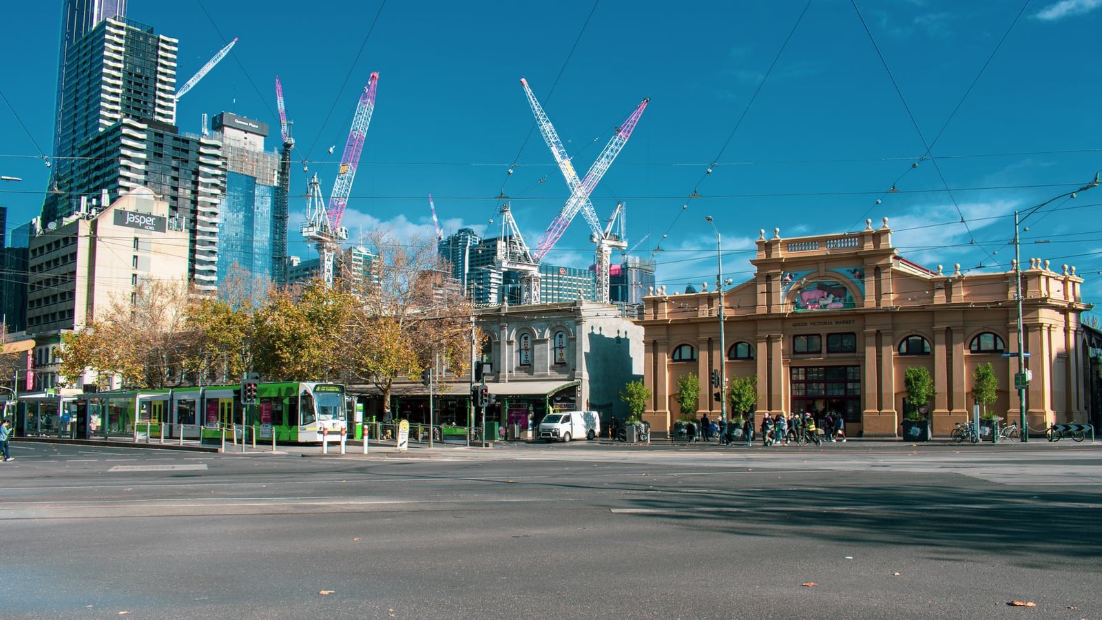 A wide cinematic view of a street in the Melbourne Central Business District.