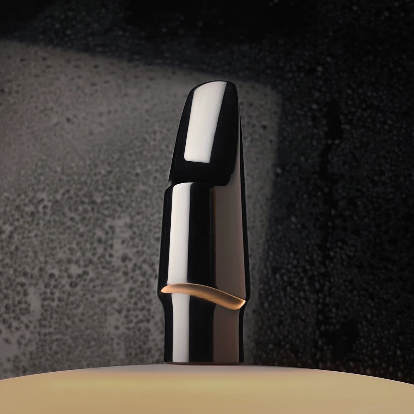Extreme close-up of a fountain pen nib on paper, symbolizing editorial precision.