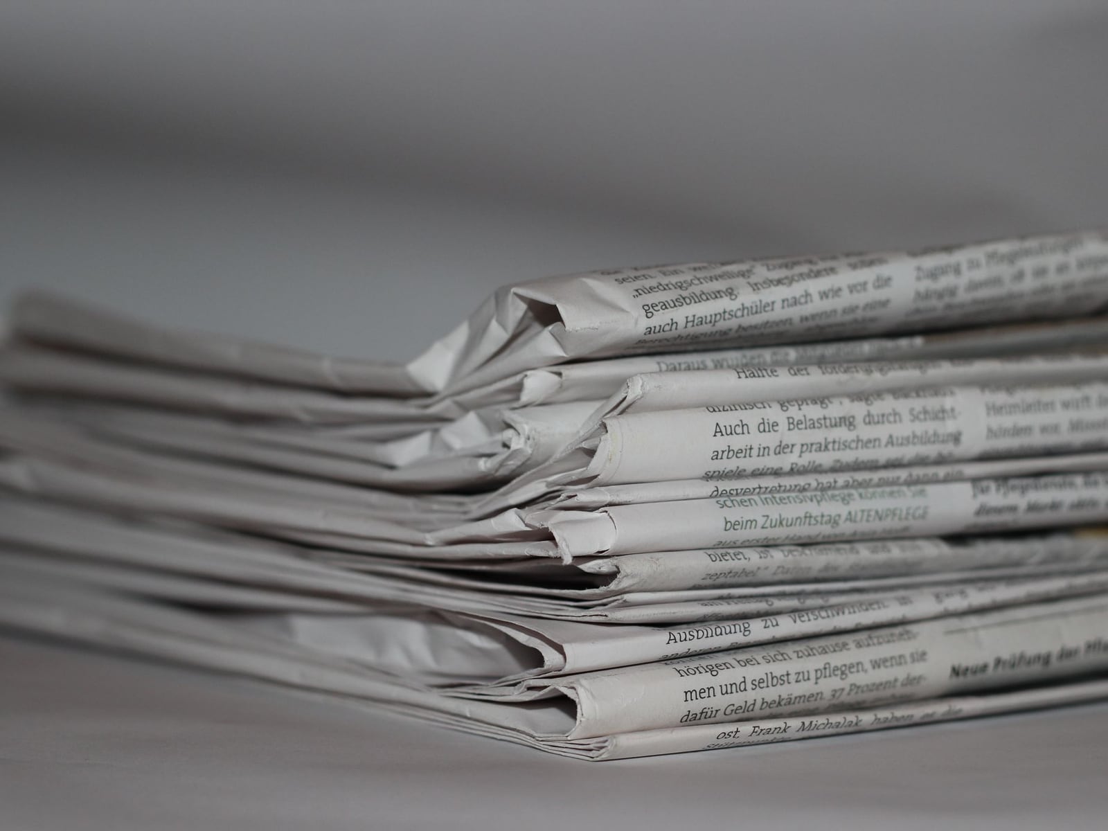 A digital tablet displaying a press release layout on a minimalist office desk.